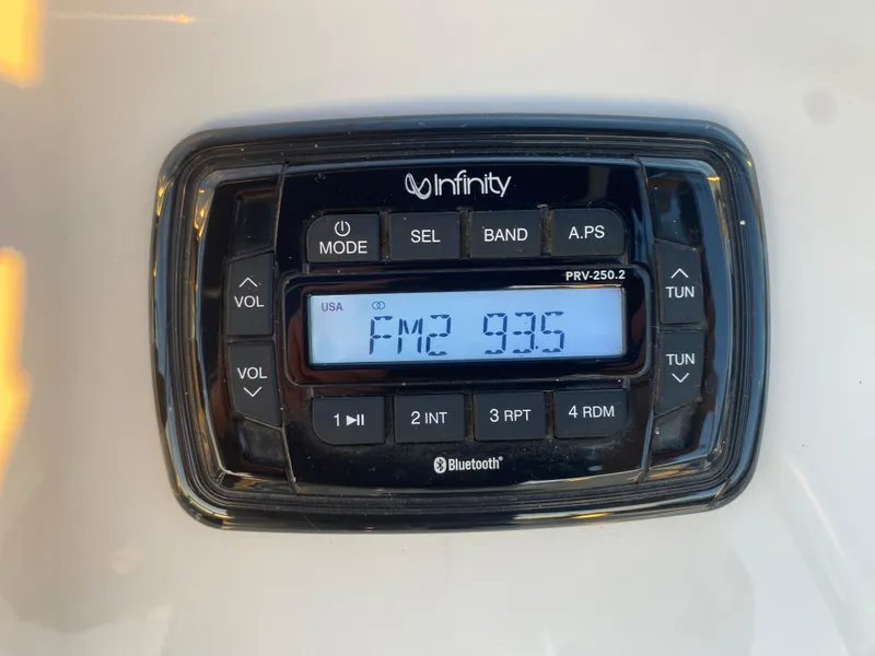 Slide: The Image of Infinity radio display on a 2017 Carolina Skiff Sea Skiff 21CC, tuned to FM 93.5. - 19
