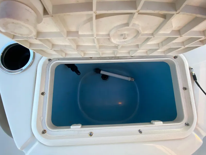 Slide: The Image of Open storage compartment in 2017 Carolina Skiff Sea Skiff 21CC boat. - 22