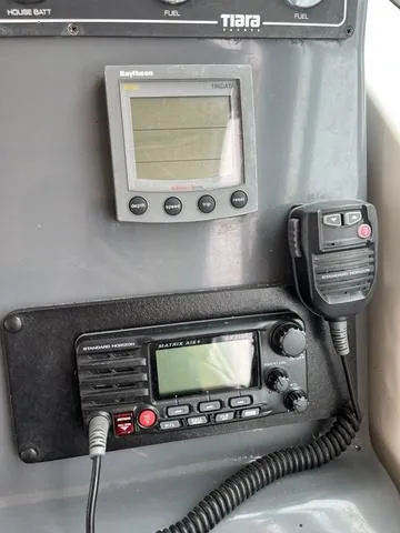 Slide: The Image of 1999 Tiara Yachts 3500 Express dashboard with Raytheon display and Matrix AIS radio. - 22
