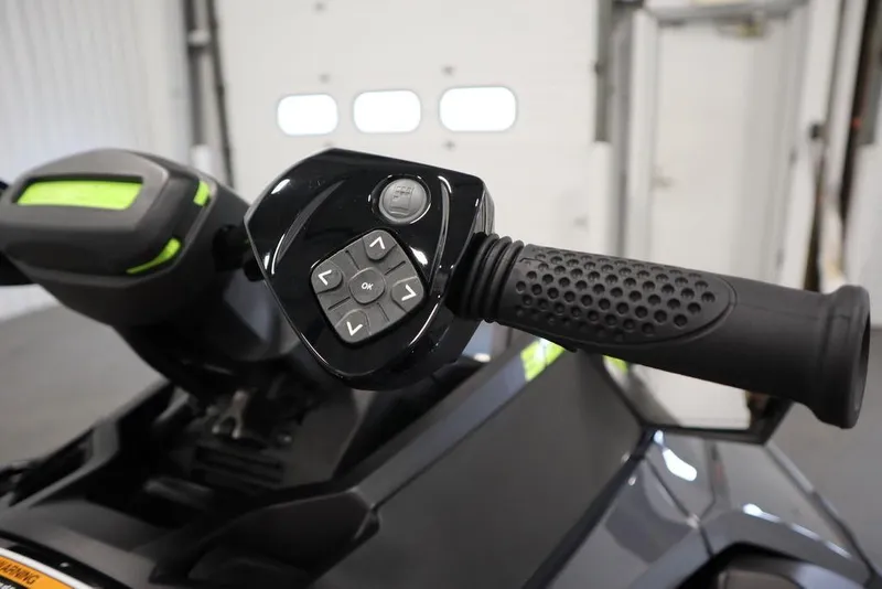 Slide: The Image of 2025 Sea-Doo RXT-X™ 325 handlebar controls, Ice Metal and Manta Green design. - 10