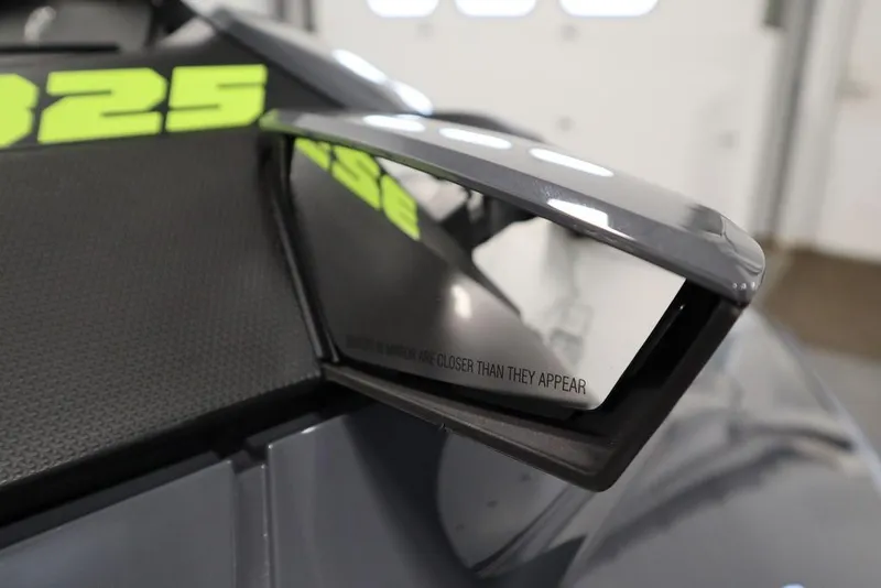 Slide: The Image of Close-up of 2025 Sea-Doo RXT-X™ 325 side mirror, Ice Metal/Manta Green design. - 14
