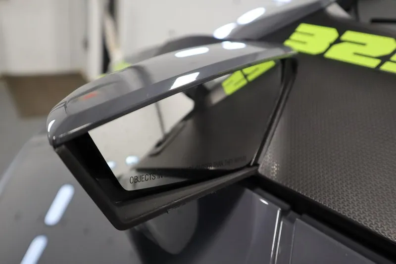 Slide: The Image of 2025 Sea-Doo RXT-X™ 325 side mirror, Ice Metal/Manta Green, close-up view. - 15