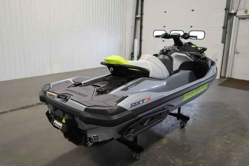 Slide: The Image of 2025 Sea-Doo RXT-X™ 325 in Ice Metal and Manta Green, parked indoors. - 19