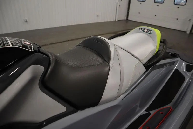 Slide: The Image of 2025 Sea-Doo RXT-X™ 325 seat in Ice Metal and Manta Green, close-up view. - 6