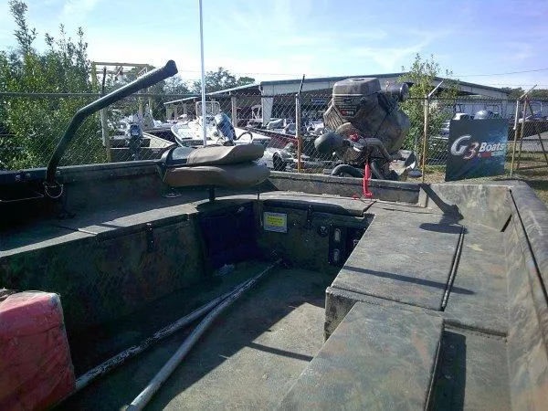 Slide: The Image of Interior of Excel 1854 SWV4T boat, 2026 model, in a boatyard setting. - 4