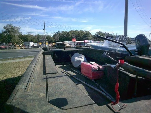 Slide: The Image of Boat interior with equipment, featuring Excel 1854 SWV4T model, 2026, parked near a road. - 5