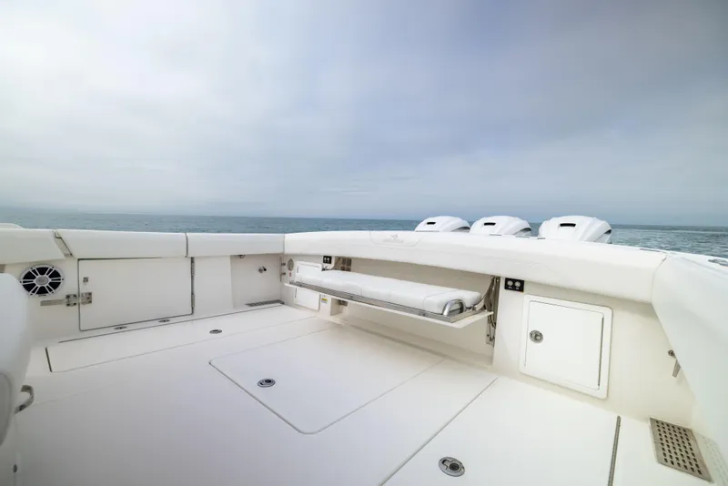Slide: The Image of 2023 Regulator 37 boat deck with seating and storage, ocean view. - 19