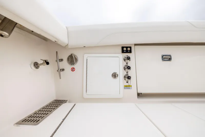 Slide: The Image of 2023 Regulator 37 boat interior with control panel and storage compartments. - 24