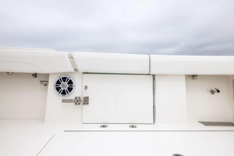 Slide: The Image of 2023 Regulator 37 boat interior with speaker and storage compartment. - 26