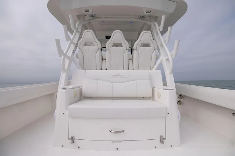 Slide: The Image of 2023 Regulator 37 boat interior with white seating and helm chairs. - 29