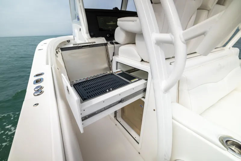 Slide: The Image of 2023 Regulator 37 boat with open storage compartment on deck. - 35