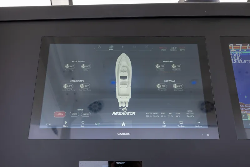 Slide: The Image of Garmin display on 2023 Regulator 37 boat showing system controls and diagnostics. - 42