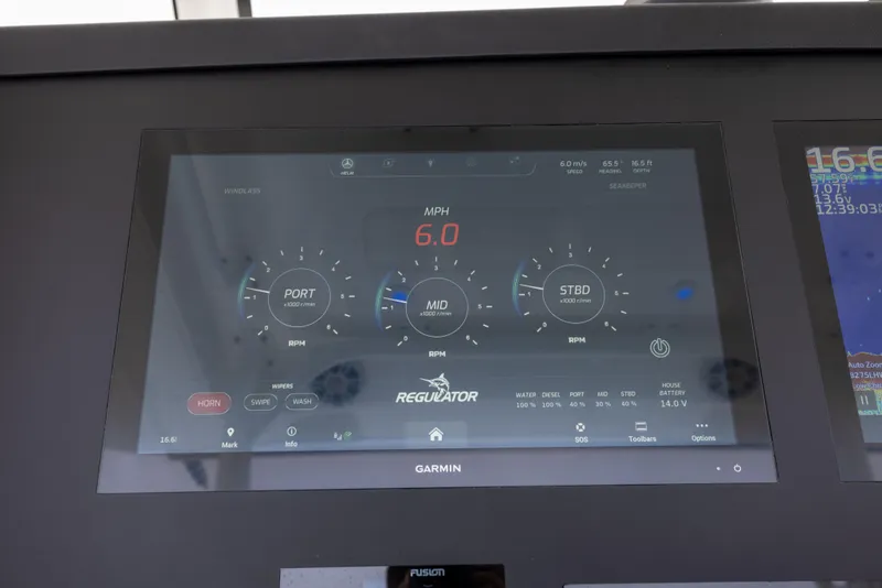 Slide: The Image of Garmin display on 2023 Regulator 37 boat showing speed and engine data. - 43