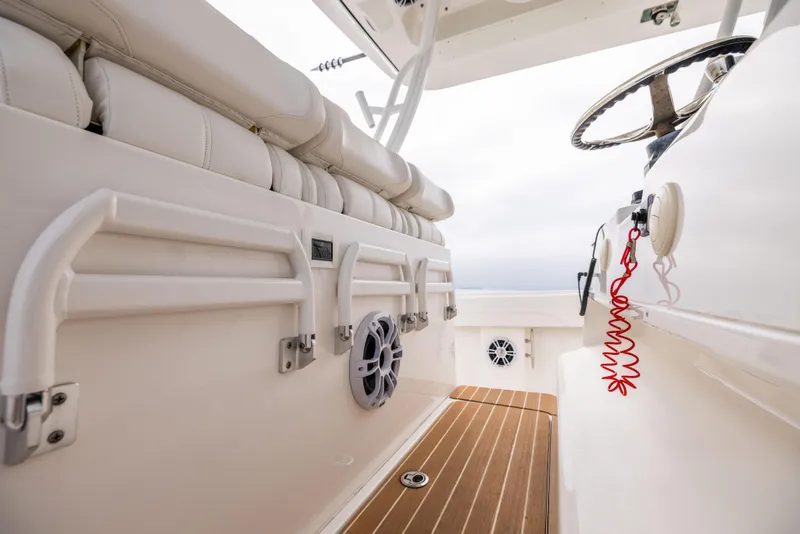 Slide: The Image of 2023 Regulator 37 boat interior with seating and steering wheel. - 46