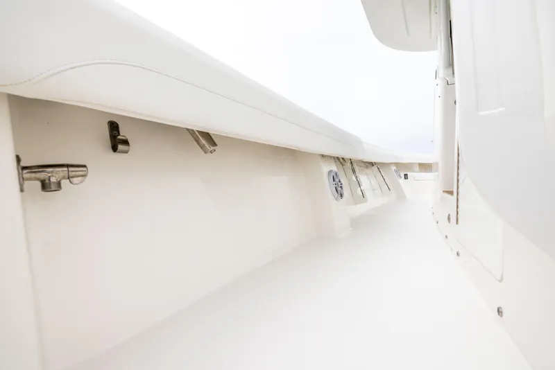 Slide: The Image of 2023 Regulator 37 boat interior, showcasing sleek white design and modern fittings. - 48