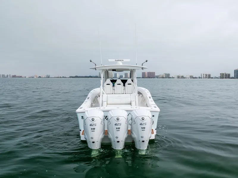 Slide: The Image of 2023 Regulator 37 boat with triple 425 V8 engines on open water. - 6