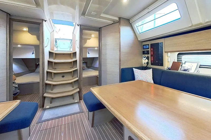Slide: The Image of Luxurious interior of 2024 Kufner 54 yacht with modern seating and wooden finishes. - 18