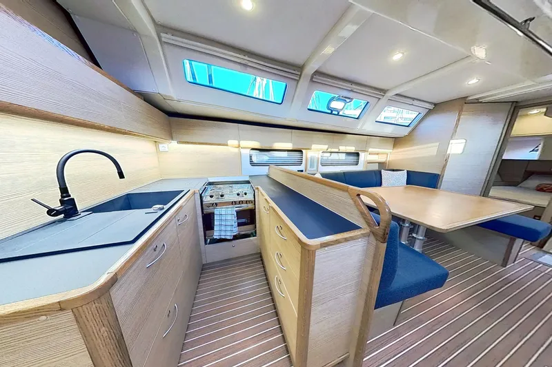 Slide: The Image of Luxurious interior of 2024 Kufner 54 yacht with modern kitchen and dining area. - 22