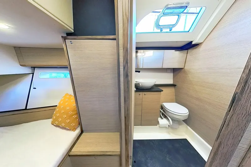 Slide: The Image of 2024 Kufner 54 yacht interior with modern bathroom and cozy cabin. - 25