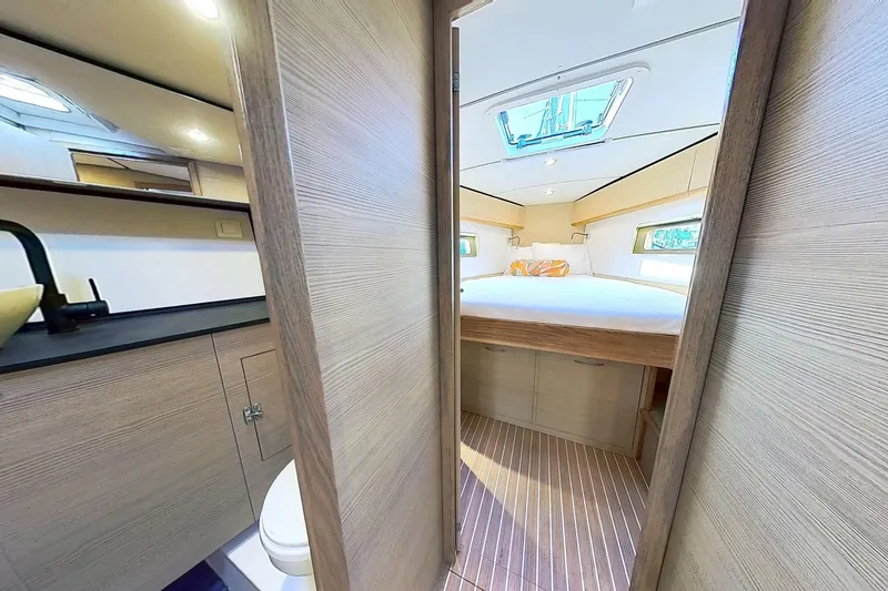 Slide: The Image of Luxurious interior of 2024 Kufner 54 yacht featuring a cozy bedroom and modern bathroom. - 30