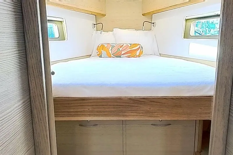 Slide: The Image of Cozy cabin bedroom in 2024 Kufner 54 yacht with modern design and colorful pillow. - 32
