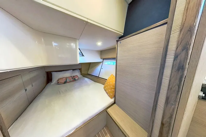 Slide: The Image of Cozy cabin interior of 2024 Kufner 54 yacht with comfortable bedding and wooden accents. - 39