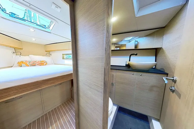 Slide: The Image of Luxurious interior of 2024 Kufner 54 yacht featuring a cozy bedroom and modern bathroom. - 40