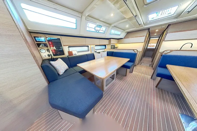 Slide: The Image of Luxurious interior of 2024 Kufner 54 yacht with blue seating and wooden accents. - 42