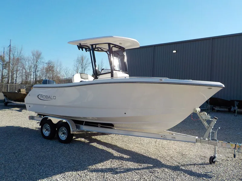 Slide: The Image of 2025 Robalo Explorer R232EX boat on trailer outdoors. - 8