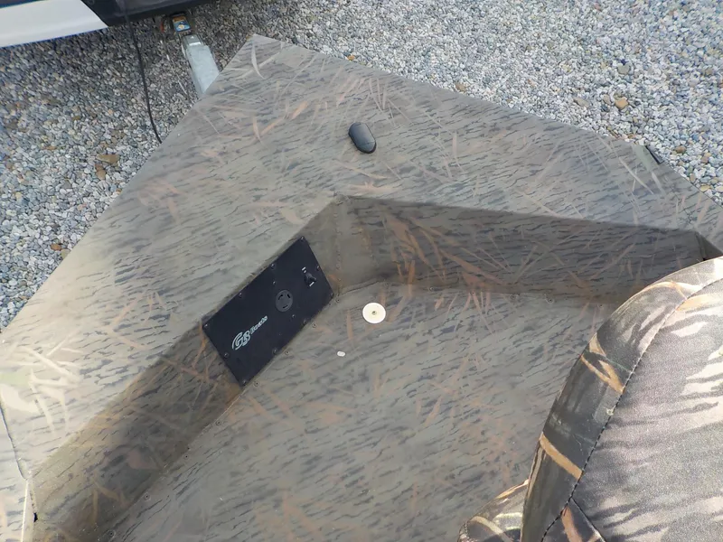 Slide: The Image of 2022 G3 Bay 22 GX boat interior with camouflage pattern and control panel. - 10