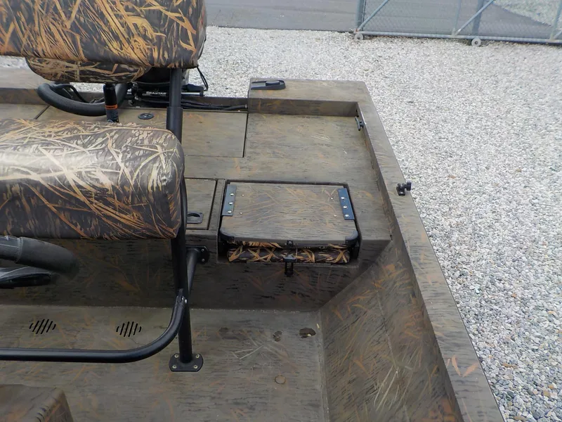 Slide: The Image of 2022 G3 Bay 22 GX boat interior with camouflage seating and storage. - 14