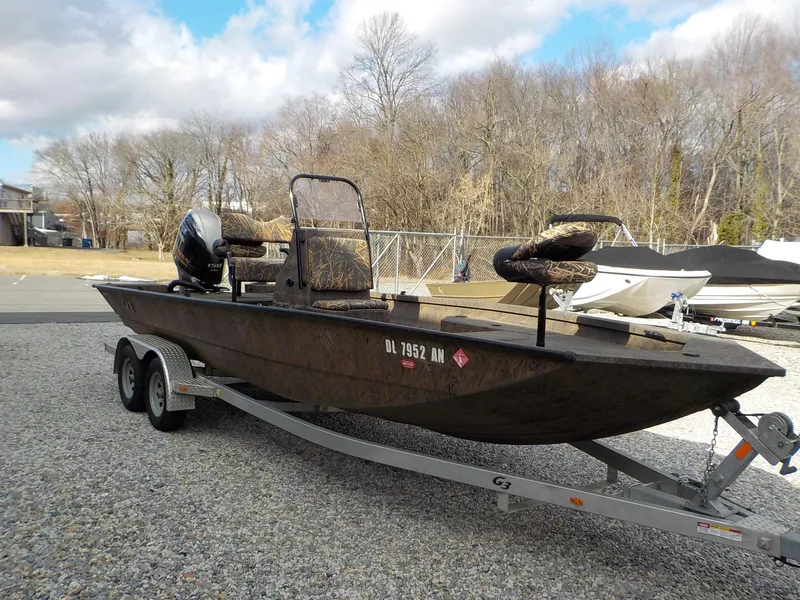 Slide: The Image of 2022 G3 Bay 22 GX boat on trailer, parked outdoors. - 20