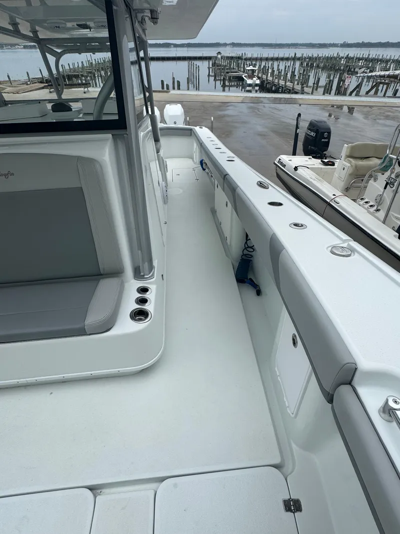 Slide: The Image of 2017 Yellowfin 39 Offshore boat docked, featuring spacious deck and seating area. - 15