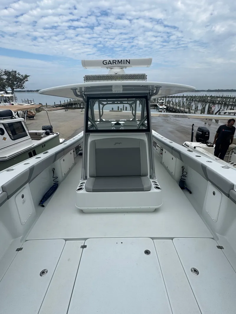 Slide: The Image of 2017 Yellowfin 39 Offshore boat with Garmin equipment, docked under a cloudy sky. - 17
