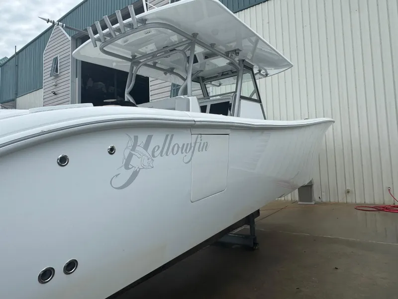 Slide: The Image of 2017 Yellowfin 39 Offshore boat in a marina setting. - 24