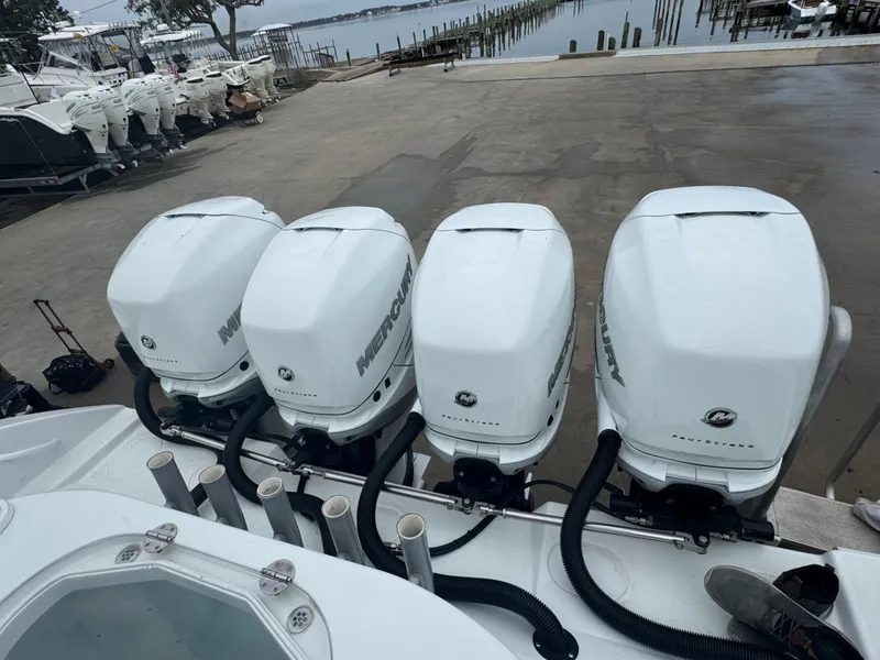 Slide: The Image of Four Mercury outboard engines on a 2017 Yellowfin 39 Offshore boat at a marina. - 5