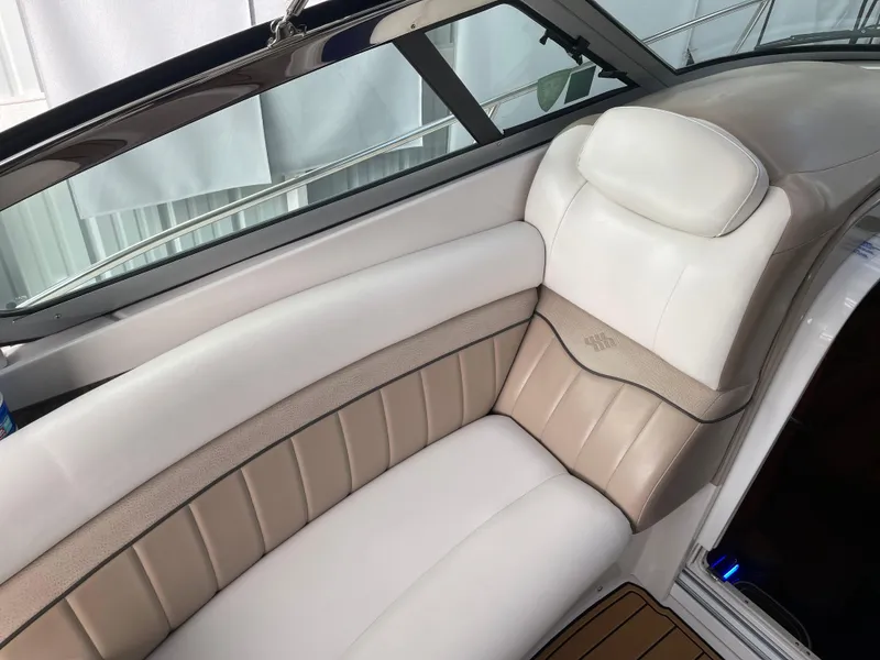 Slide: The Image of Luxurious seating on a 2006 Four Winns 350 boat, featuring beige and white upholstery. - 17