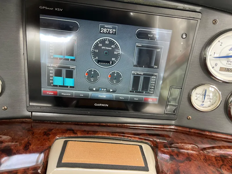 Slide: The Image of Dashboard of a 2006 Four Winns 350 boat with Garmin GPS display. - 18