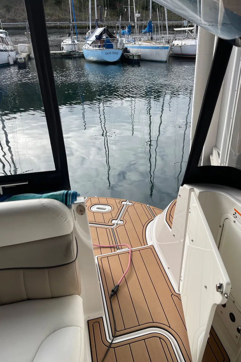 Slide: The Image of 2006 Four Winns 350 boat interior with teak deck, docked at marina. - 20
