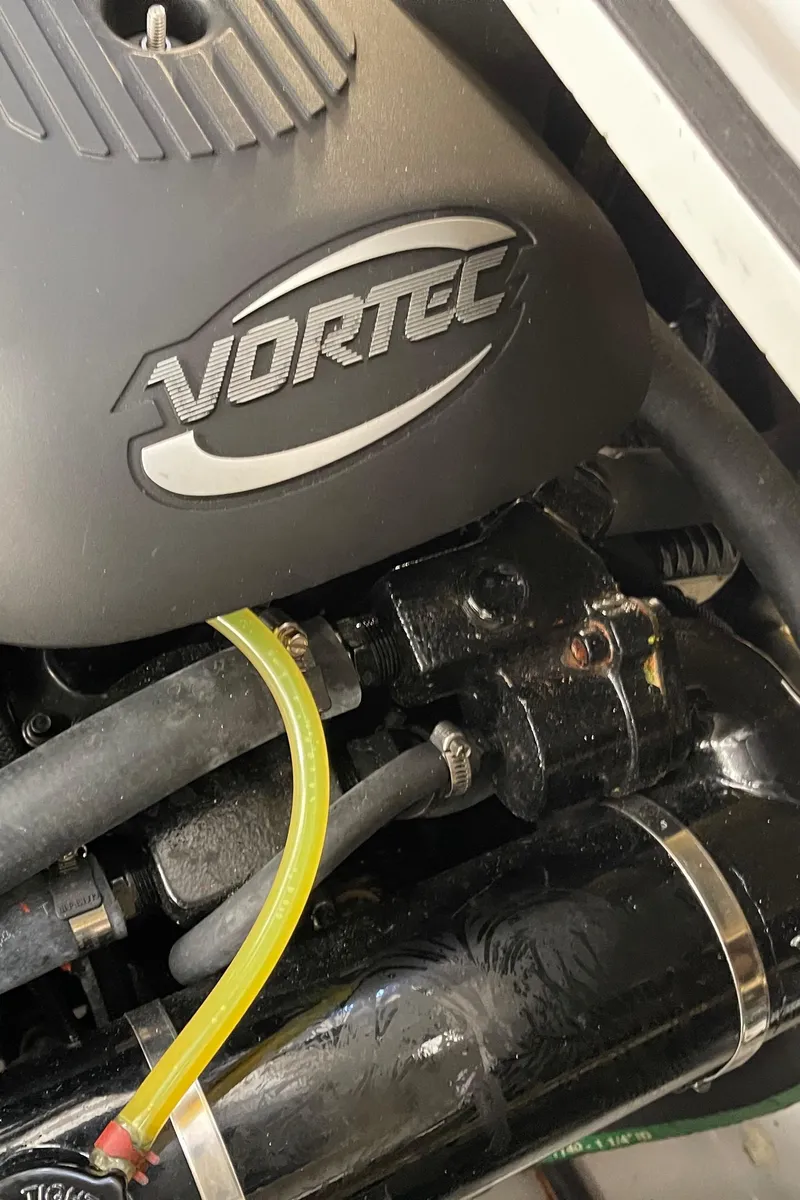 Slide: The Image of Engine compartment of a 2006 Four Winns 350 boat featuring a Vortec engine component. - 28