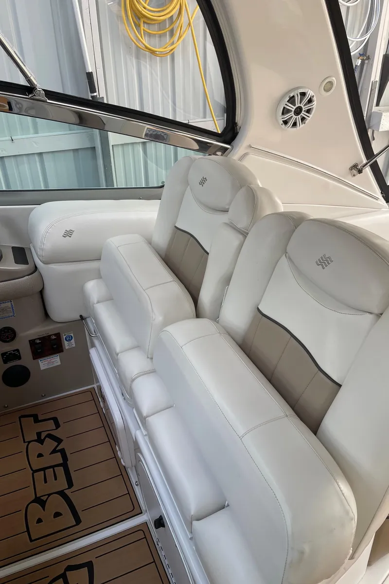 Slide: The Image of 2006 Four Winns 350 boat interior with white leather seating. - 30