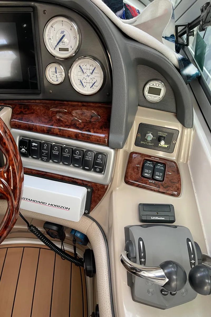 Slide: The Image of Control panel of a 2006 Four Winns 350 boat with gauges and switches. - 31