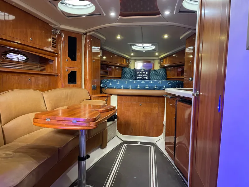 Slide: The Image of Luxurious interior of a 2006 Four Winns 350 yacht with wood finishes and cozy seating. - 34
