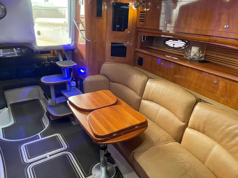 Slide: The Image of Luxurious 2006 Four Winns 350 yacht interior with elegant wood finishes and comfortable seating. - 35