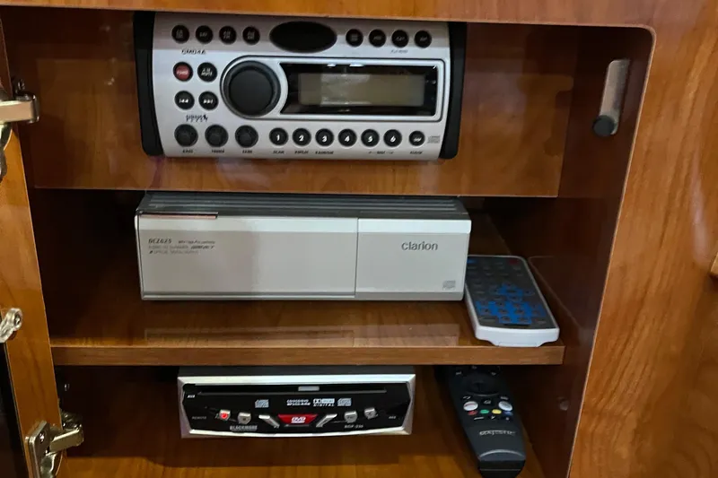 Slide: The Image of 2006 Four Winns 350 boat stereo system with Clarion components and remote controls. - 41