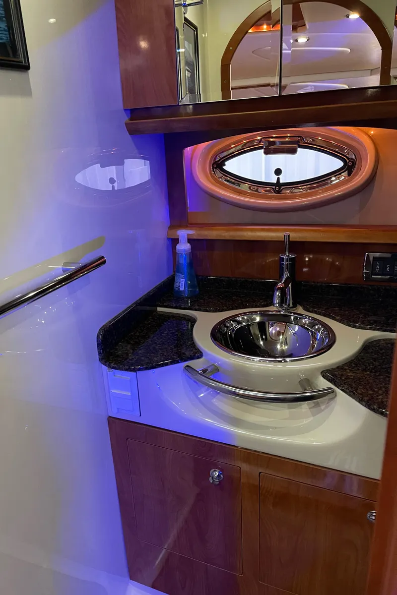 Slide: The Image of 2006 Four Winns 350 yacht bathroom with modern sink and mirror. - 44