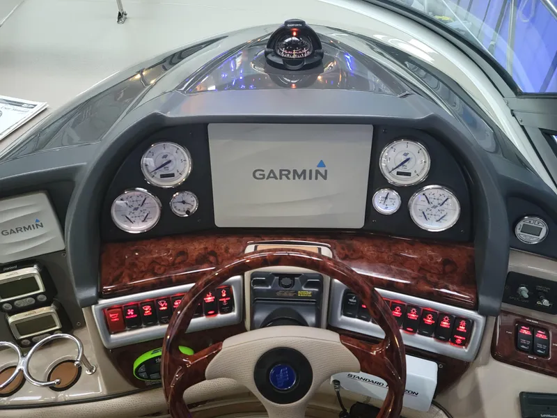 Slide: The Image of 2006 Four Winns 350 boat dashboard with Garmin navigation system and gauges. - 7