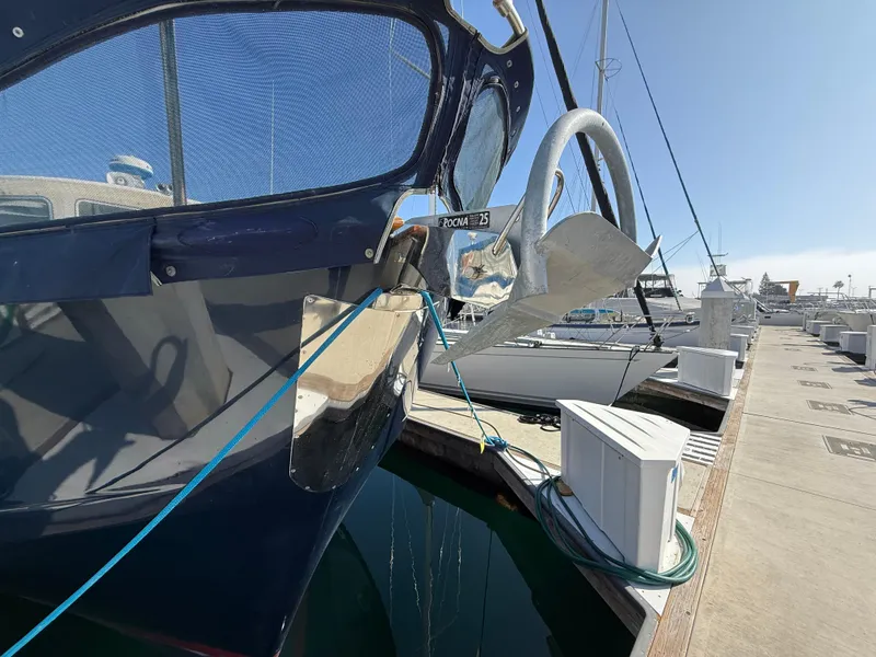Slide: The Image of 1978 Fisher 38 Trawler docked, showcasing anchor and bow details. - 13