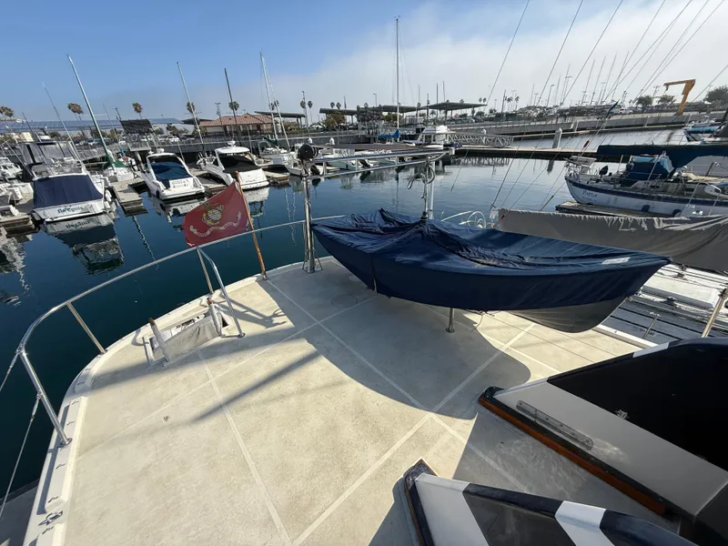 Slide: The Image of 1978 Fisher 38 Trawler docked at marina, surrounded by other boats. - 28