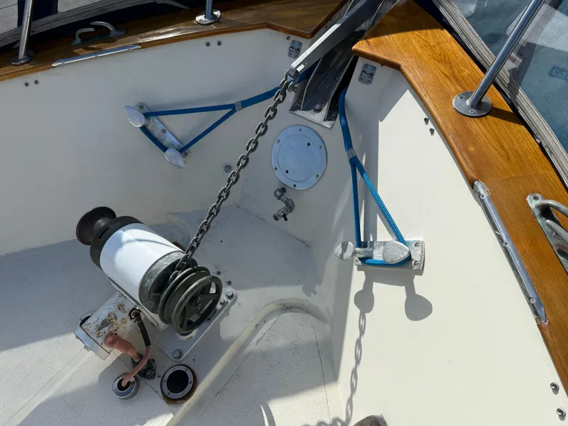 Slide: The Image of 1978 Fisher 38 Trawler deck with anchor chain and winch system. - 43